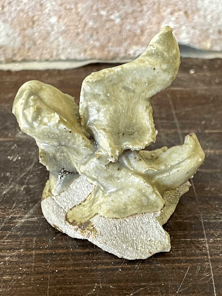 a test tile that has been squished in my hand to make a blobby tactile form